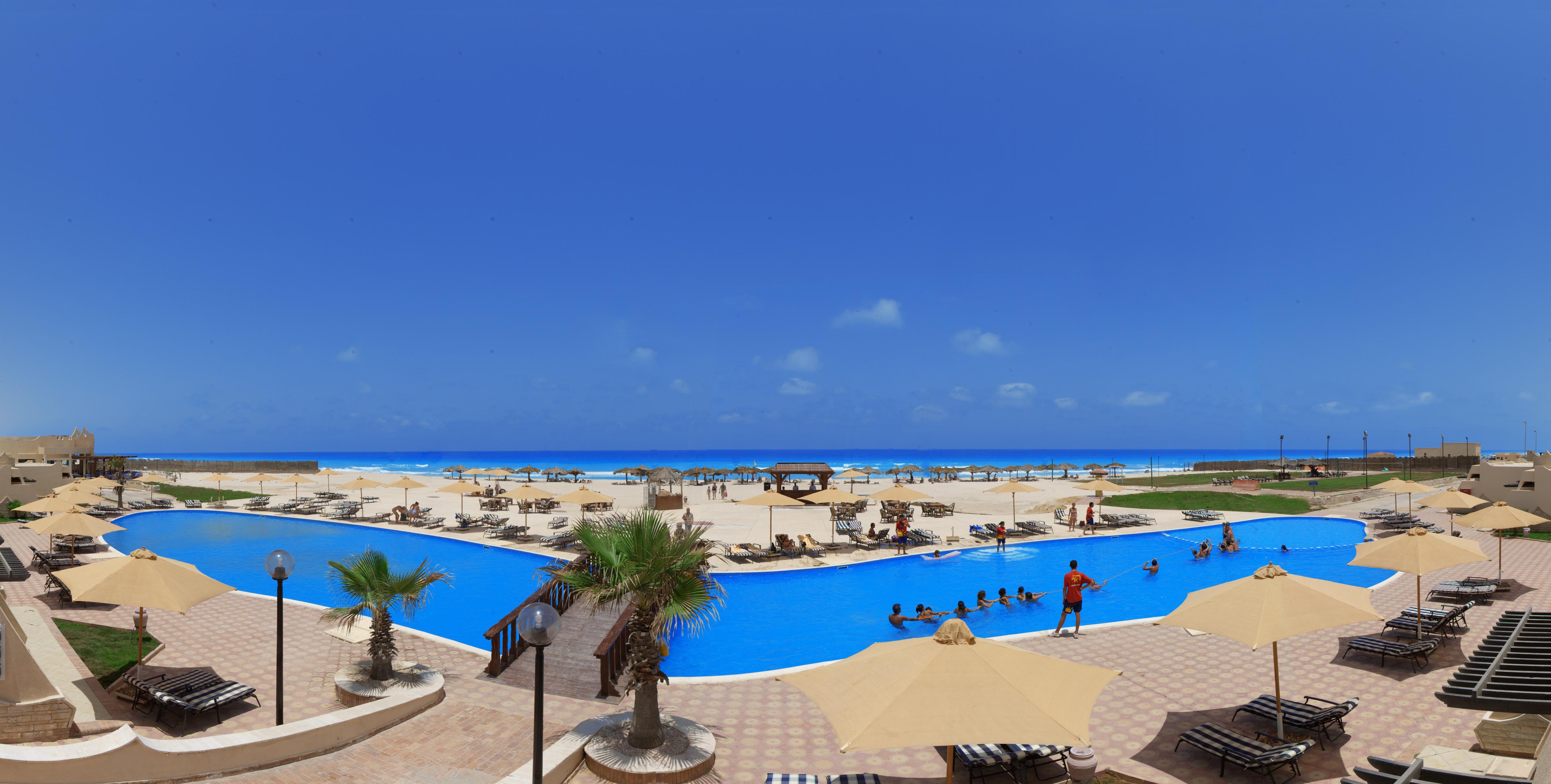Borg El Arab Beach Resort Dış mekan fotoğraf The beach at the resort
